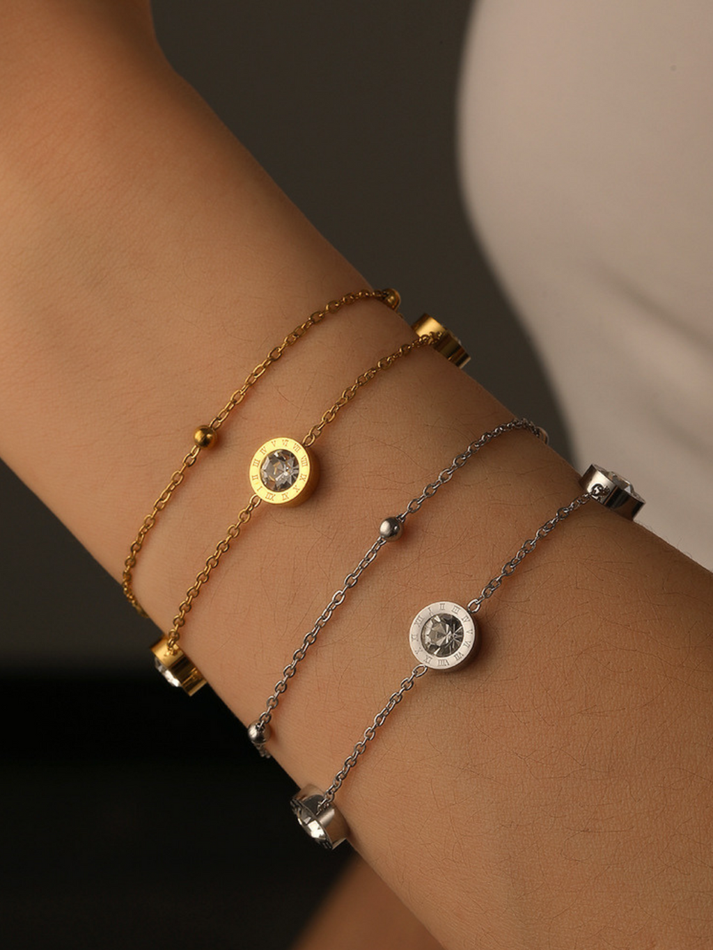 Double-layer chain detail on Rona Roman Numerals CZ Bracelet, gold tone — upper bead chain and lower CZ chain