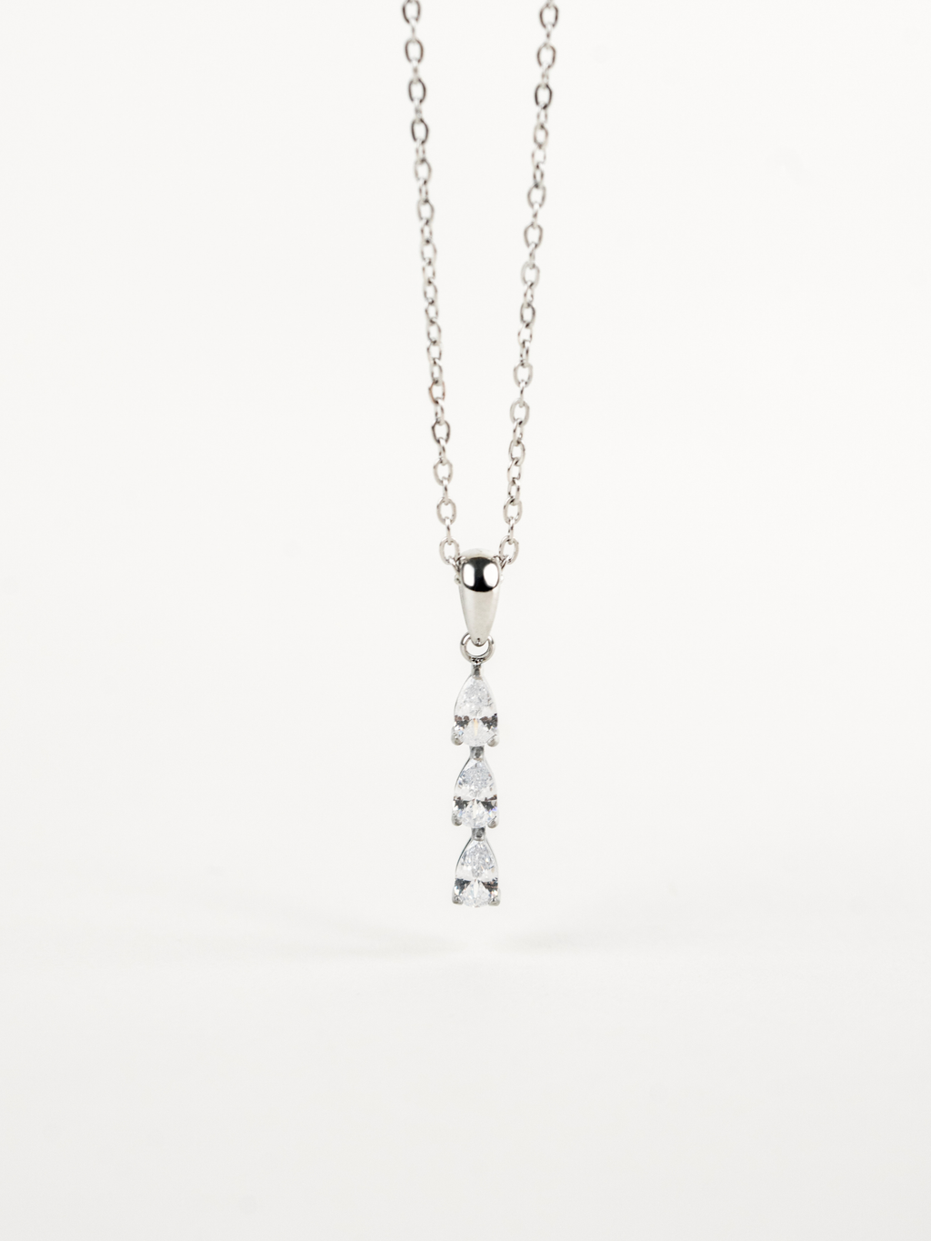 Close-up of three pear-cut stones on Tinker Dewdrop Necklace