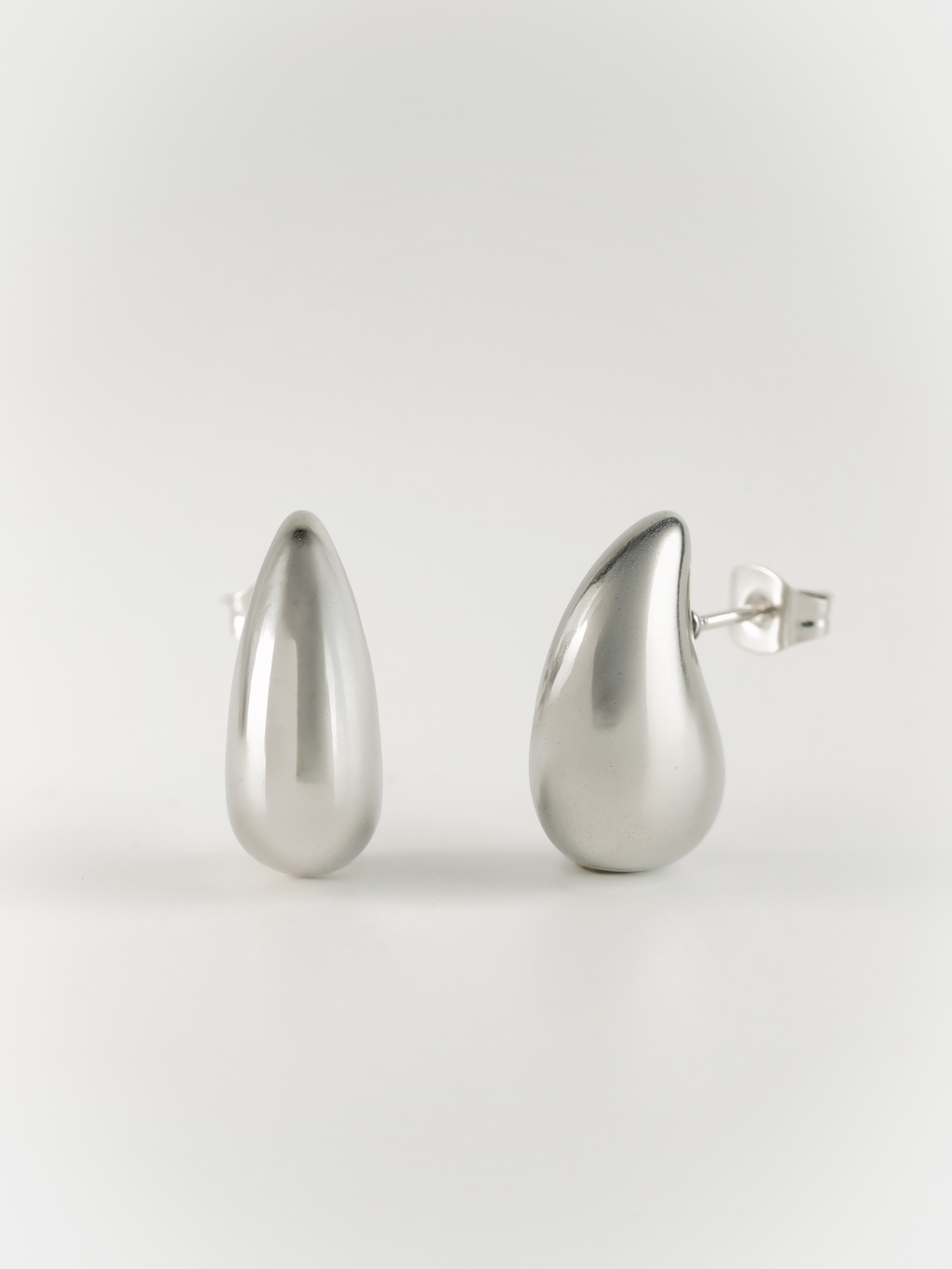 tiny diva teardrop stud earrings front view