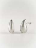 tiny diva teardrop stud earrings front view