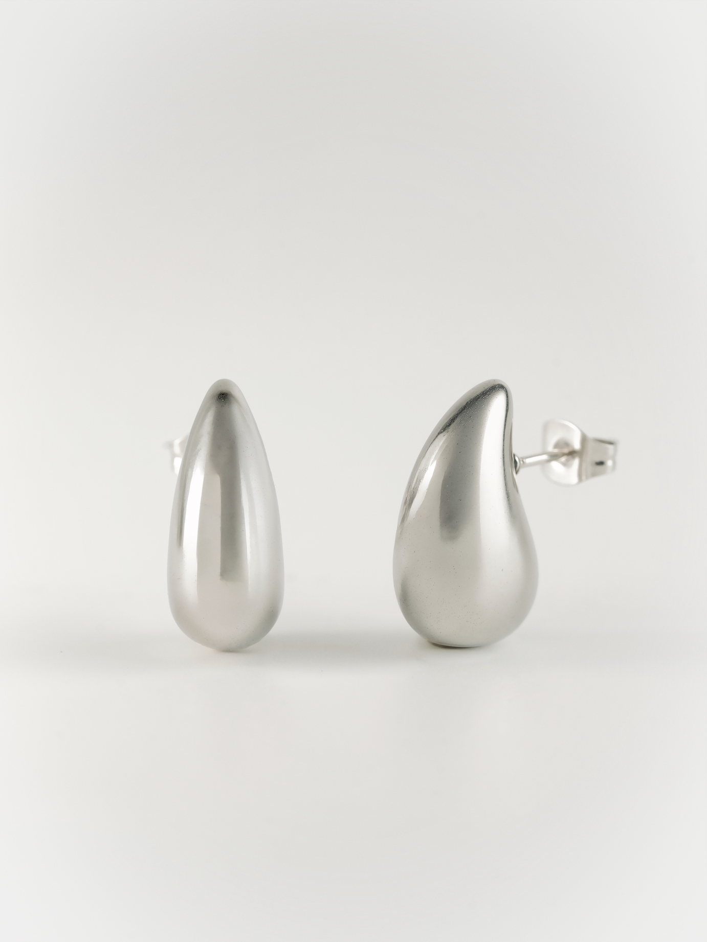 tiny diva teardrop stud earrings front view