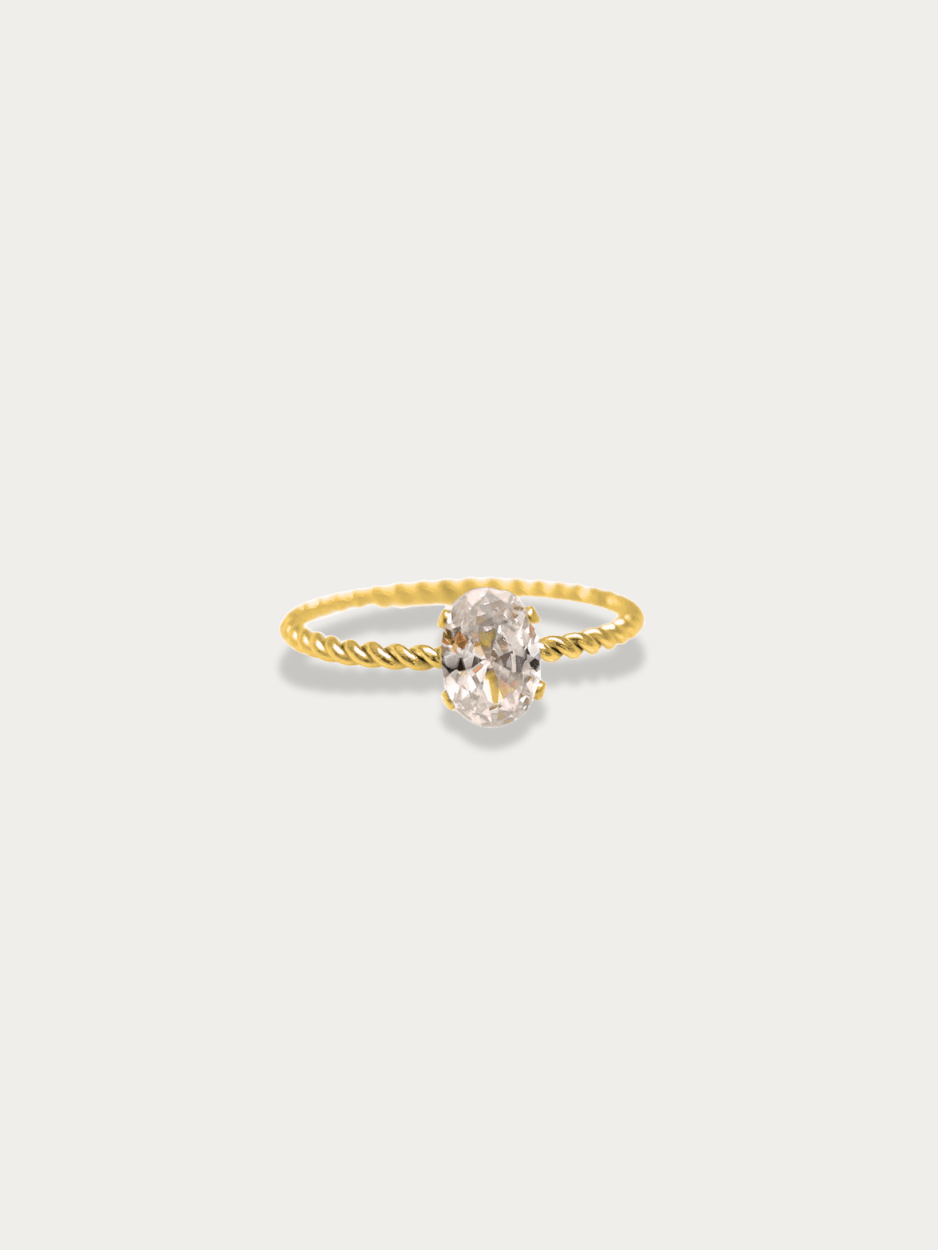 Twist Oval Solitaire Ring gold tone titanium, large oval CZ on twisted rope band, product flatlay