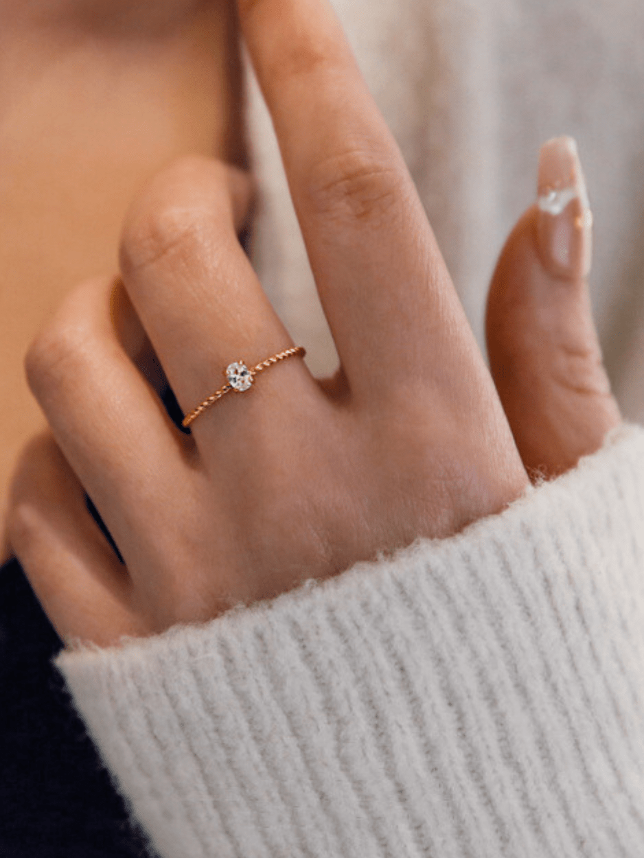 Twist Oval Solitaire Ring gold tone worn on hand, minimalist solitaire ring Malaysia lifestyle