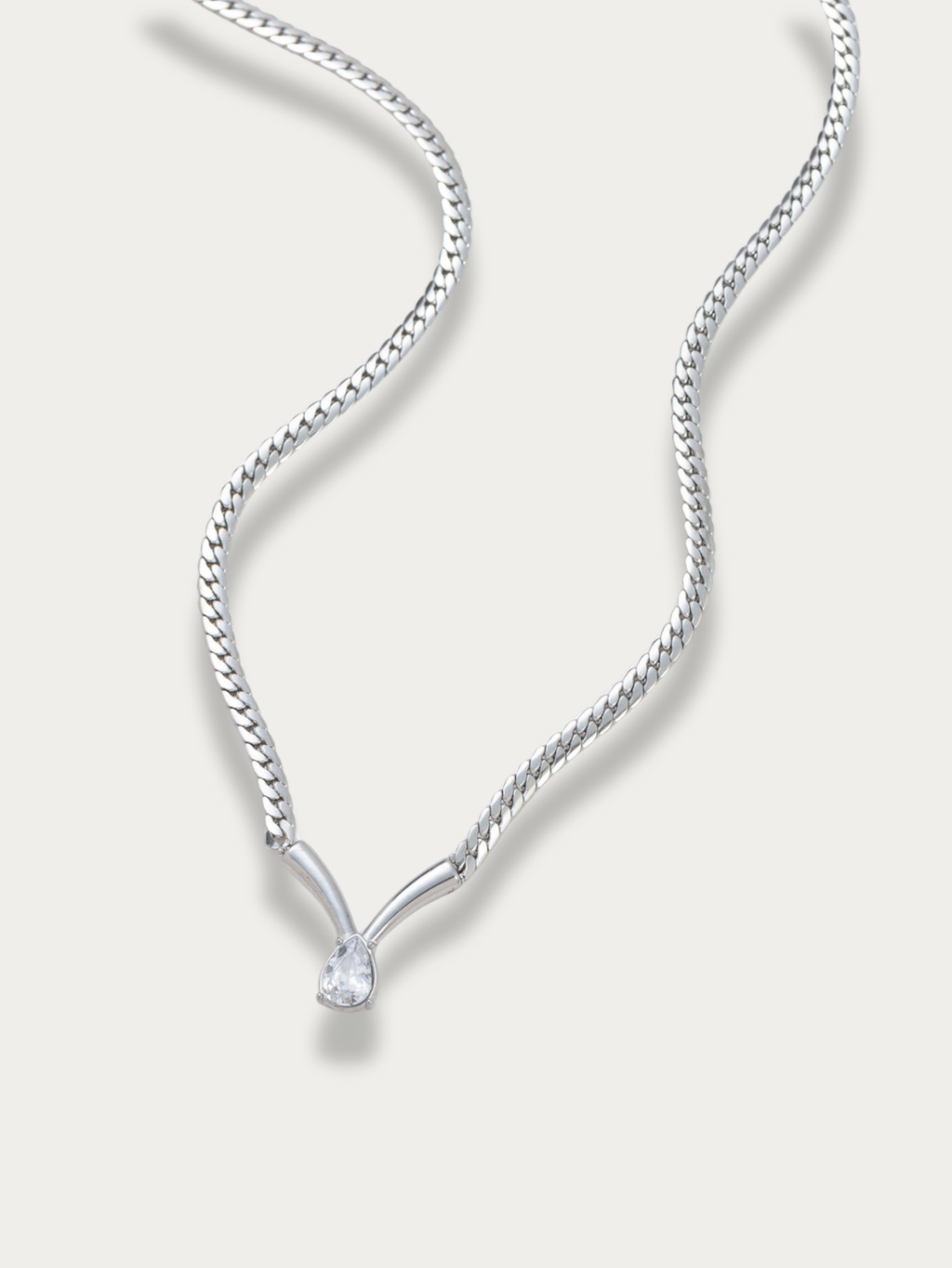 Statement silver tone necklace with teardrop stone