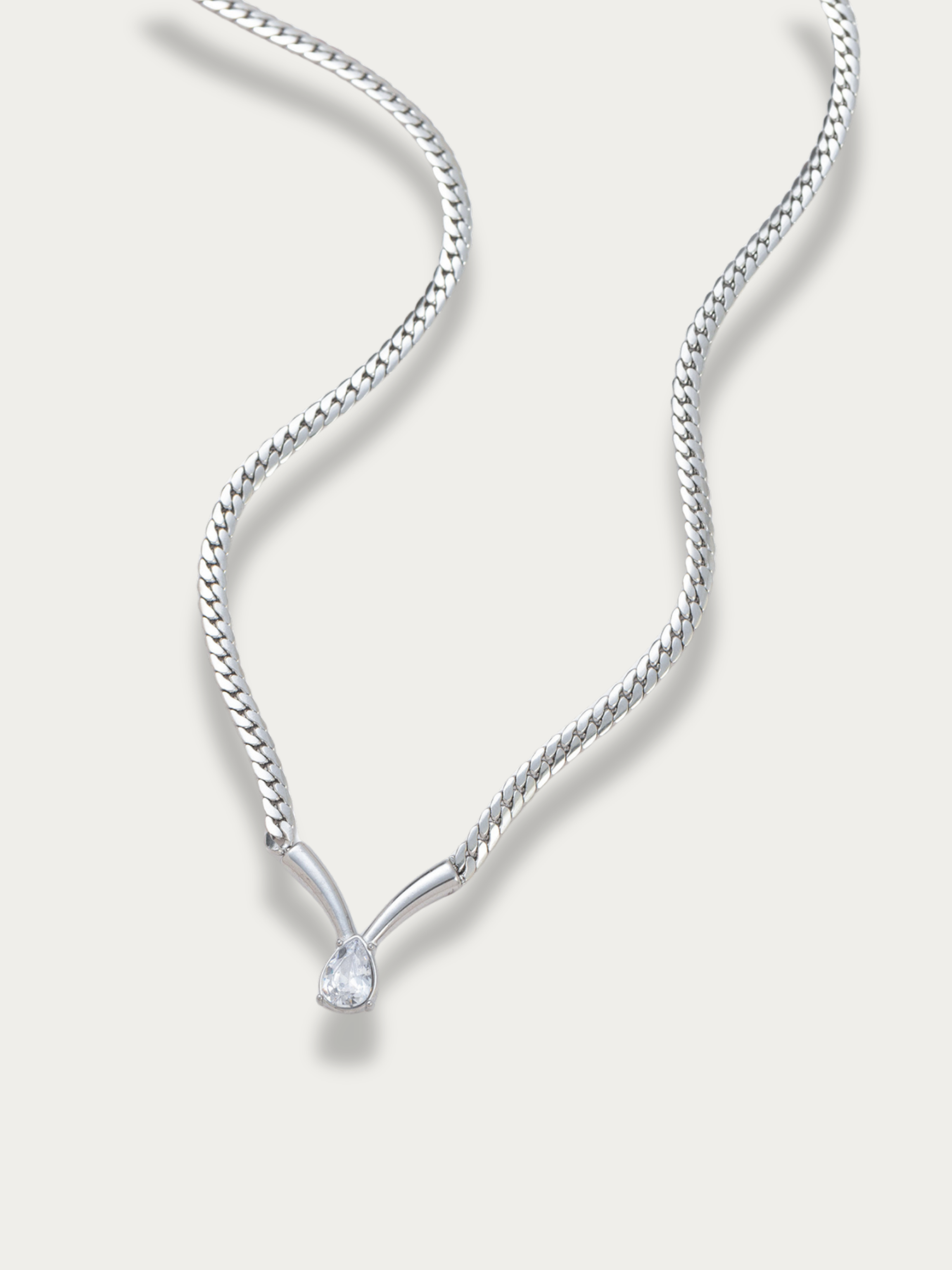 Statement silver tone necklace with teardrop stone