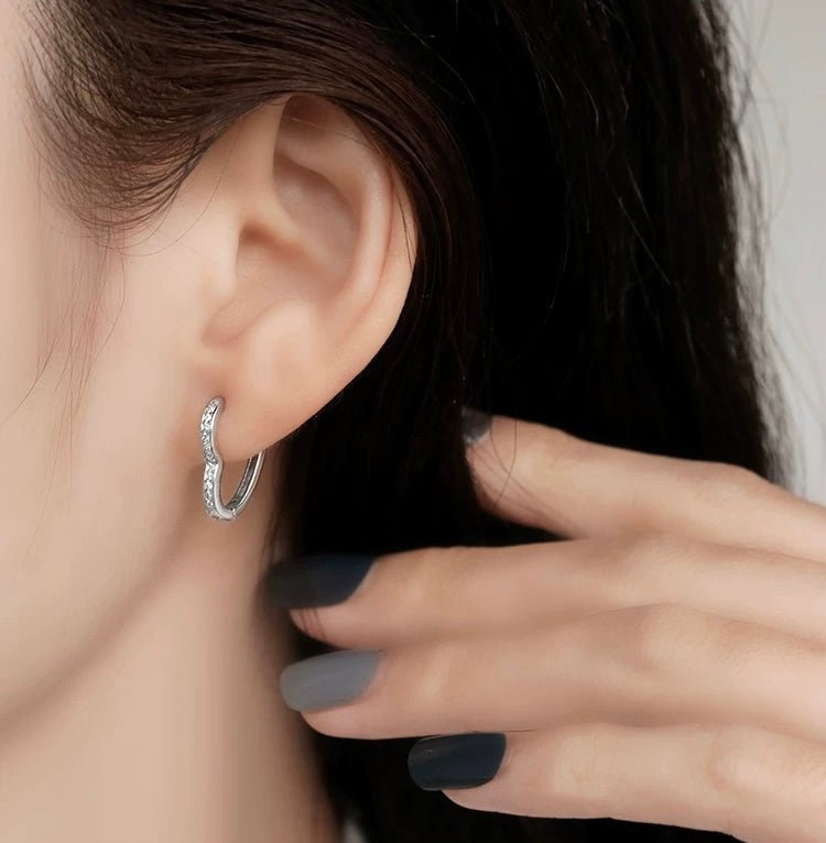Model wearing VENUS Diamond Heart Ear Hoop