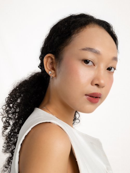 Waroq Wavy Minimalist Hoop Earrings worn on ear