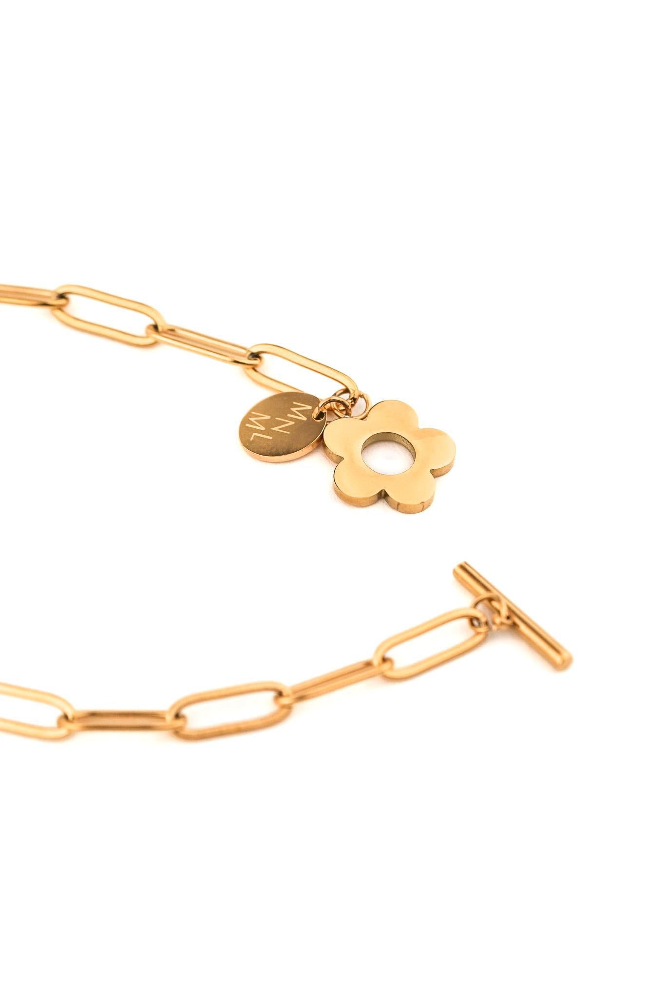 Close-up of flower pendant charm on toggle bracelet