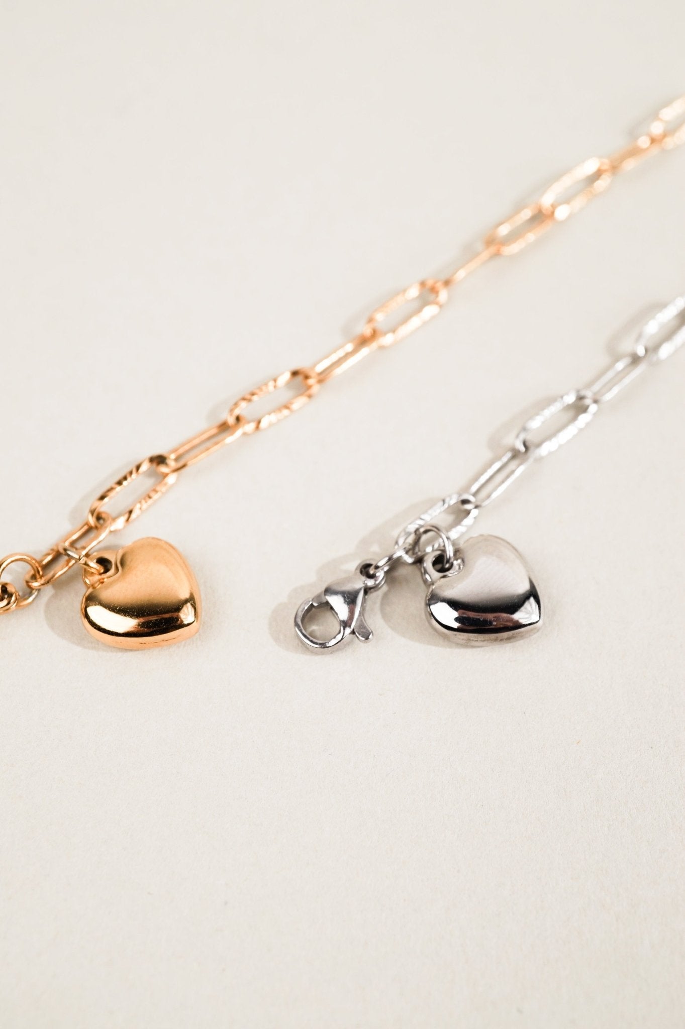 MNML Heart Chain Engravable Bracelet in silver and gold  flat lay — two colour variants