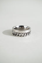 Close-up of Roman numerals engraving on MNML Phoenix Numerals Chain Ring — I II III IV V VI detail