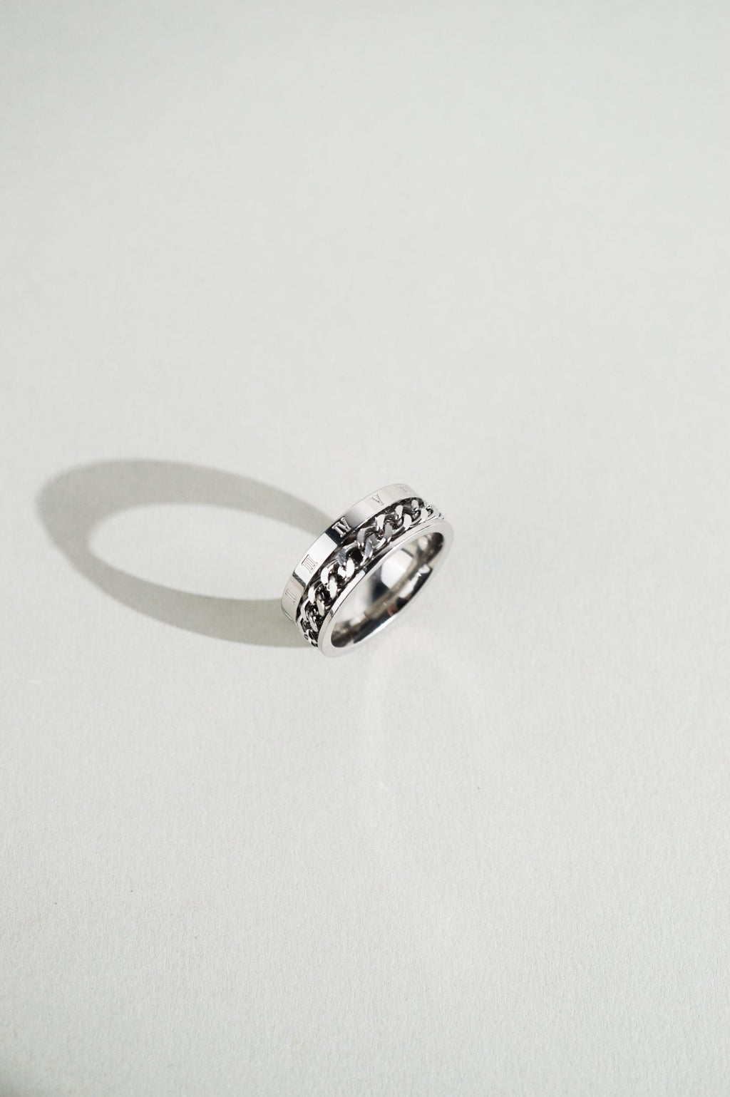 Two-tier profile detail on MNML Phoenix Numerals Chain Ring — numerals band and chain channel