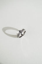 Two-tier profile detail on MNML Phoenix Numerals Chain Ring — numerals band and chain channel