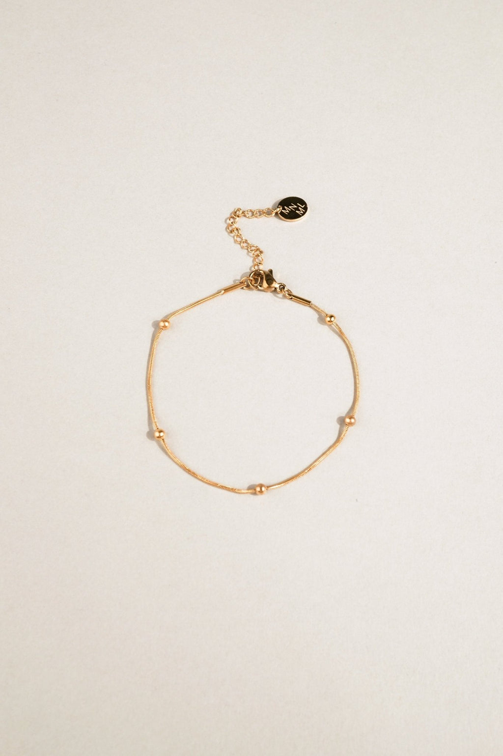 snake chain bracelet with bead accents close up