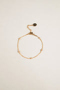 snake chain bracelet with bead accents close up