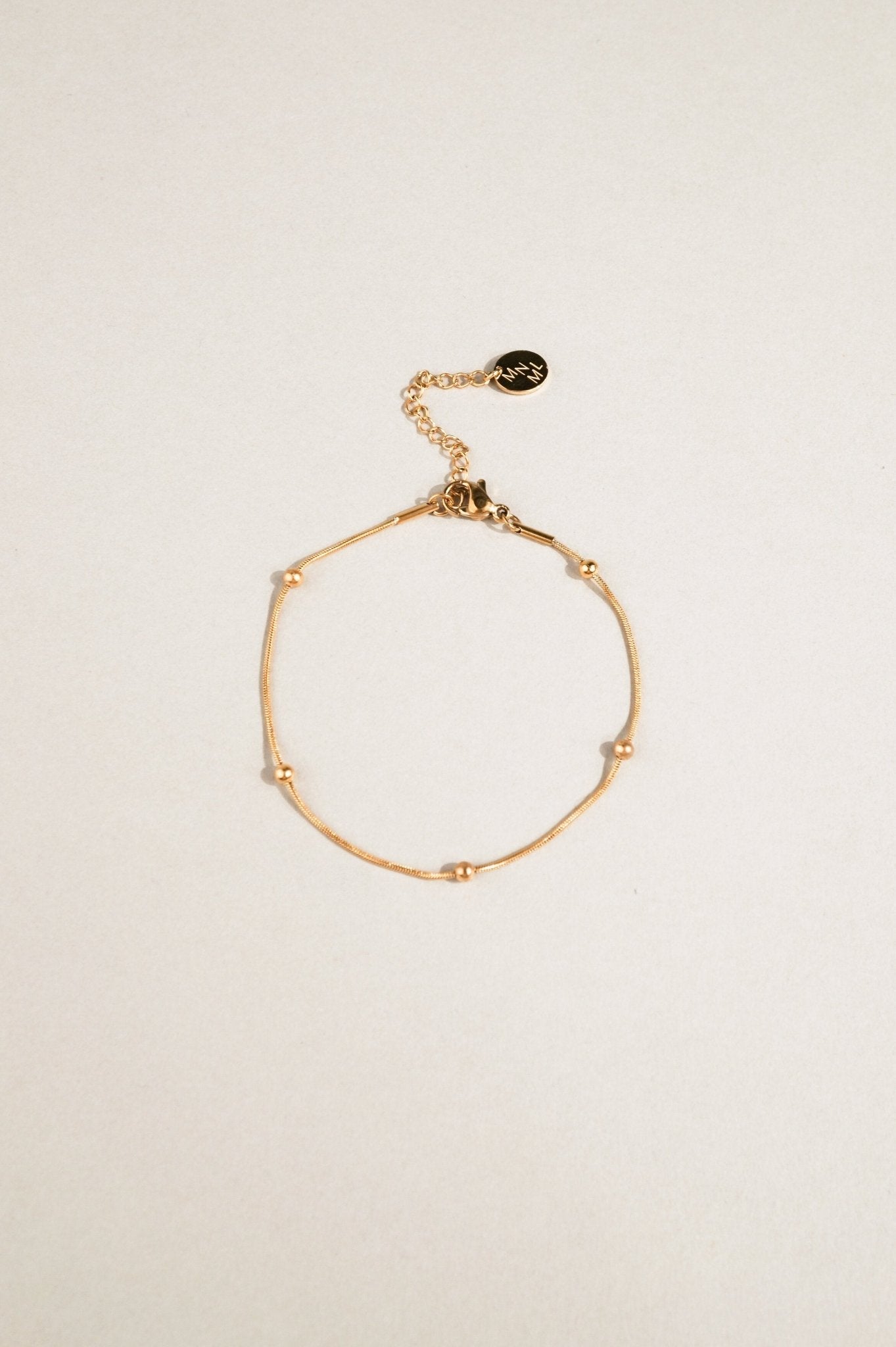 snake chain bracelet with bead accents close up